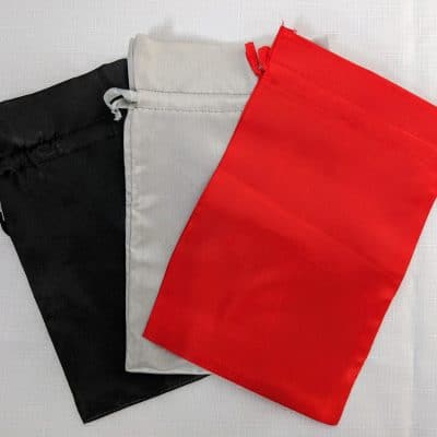 satin gift bags in black, silver, and red